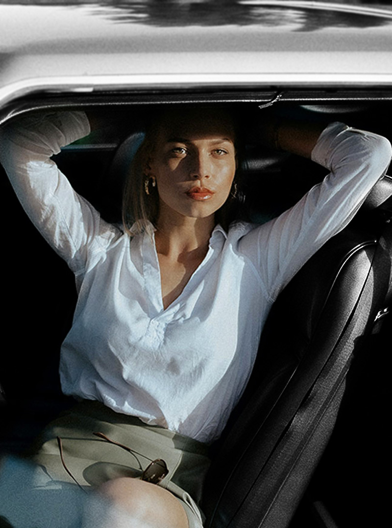 Woman in luxury car